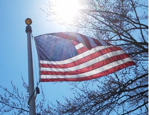 US Flag waving in the Sun
